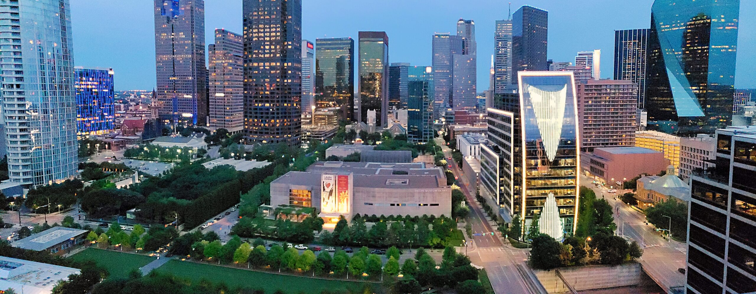 Klyde Warren Park with the downtown Dallas skyline behind it